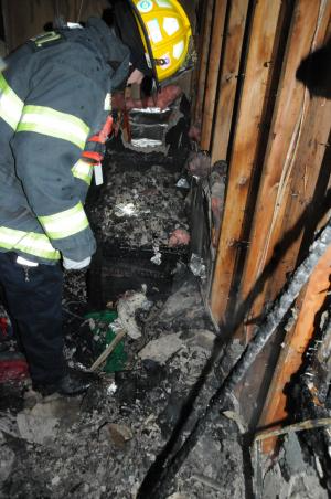 Firefighter working in building effected by fire